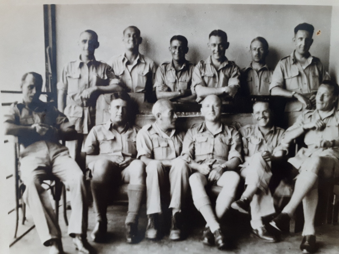 Photograph of two rows of servicemen, 12 in total